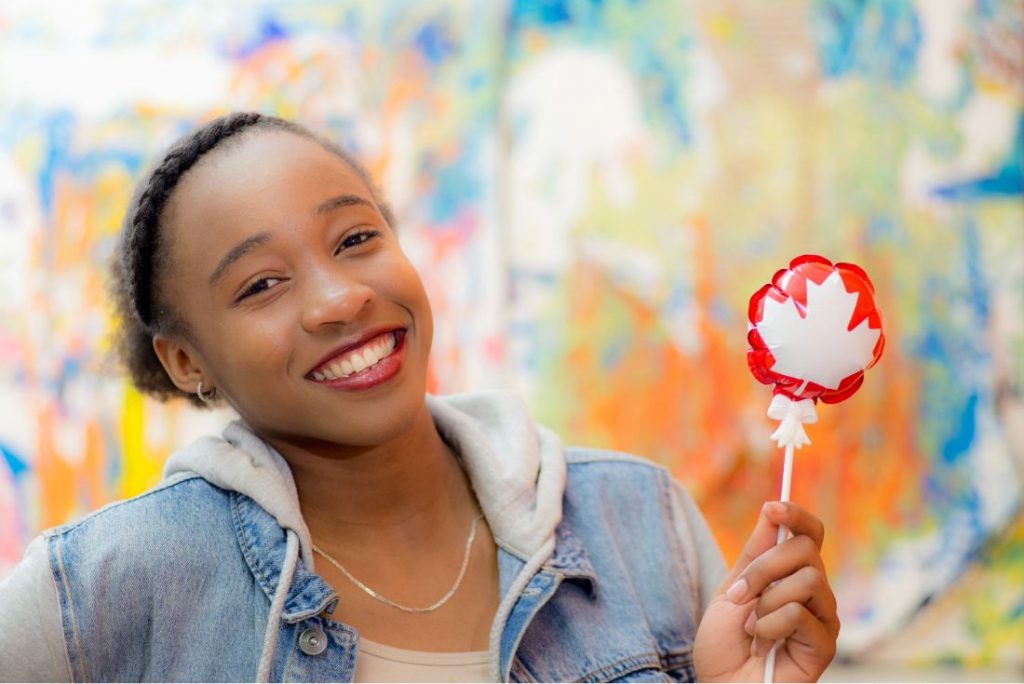 Woman Holding a balloon with maple leaf